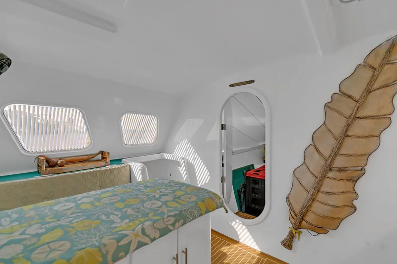 Slide: The Image of Interior of 1988 Kelsall Manannan Custom boat with tropical decor and unique wall art. - 24
