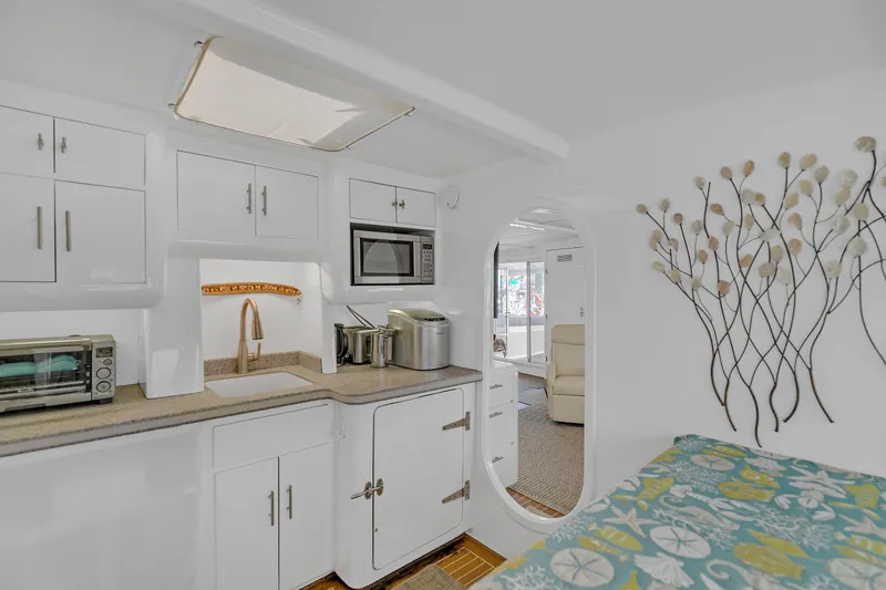 Slide: The Image of Interior of 1988 Kelsall Manannan Custom yacht with modern kitchen and decorative wall art. - 27