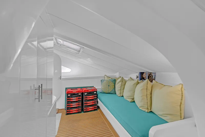 Slide: The Image of Cozy interior of 1988 Kelsall Manannan Custom boat with cushions and storage. - 31