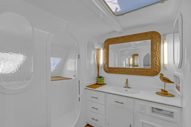 Slide: The Image of Luxurious 1988 Kelsall Manannan Custom yacht bathroom with ornate gold mirror and elegant fixtures. - 32