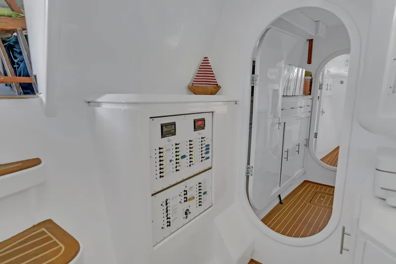 Slide: The Image of Interior of 1988 Kelsall Manannan Custom yacht with control panel and wooden flooring. - 40