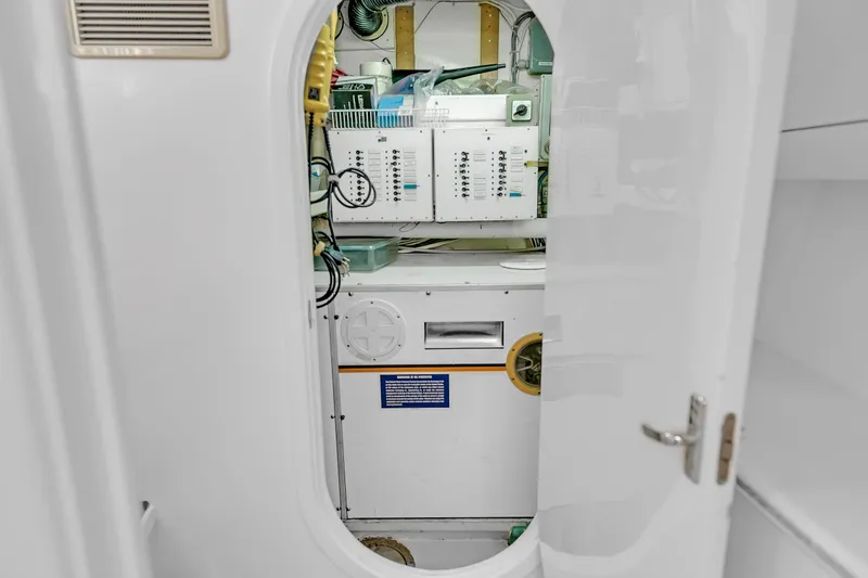 Slide: The Image of Electrical panel inside 1988 Kelsall Manannan Custom boat, viewed through open door. - 41