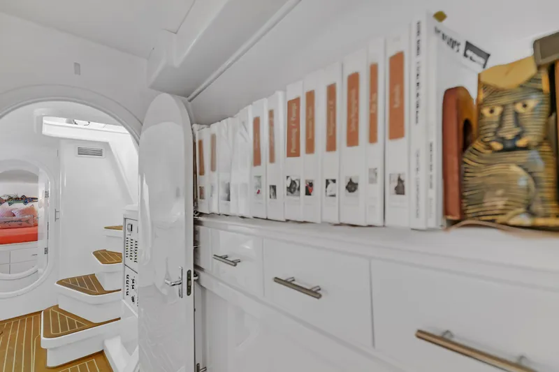 Slide: The Image of Interior of 1988 Kelsall Manannan Custom yacht with books and decorative items on shelves. - 47