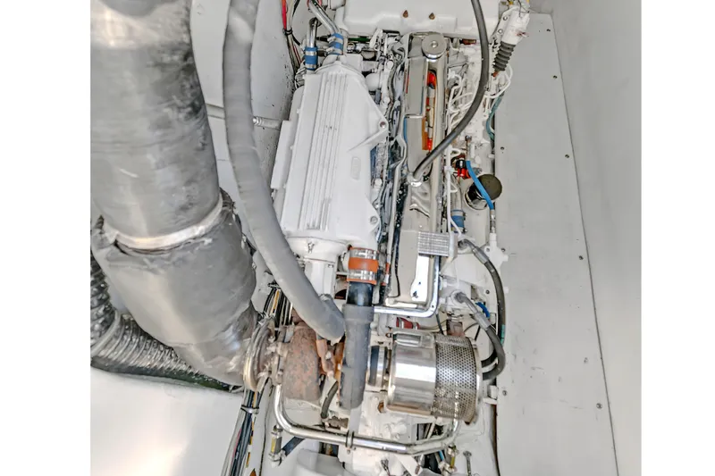 Slide: The Image of Engine compartment of 1988 Kelsall Manannan Custom boat, showcasing detailed mechanical components. - 53