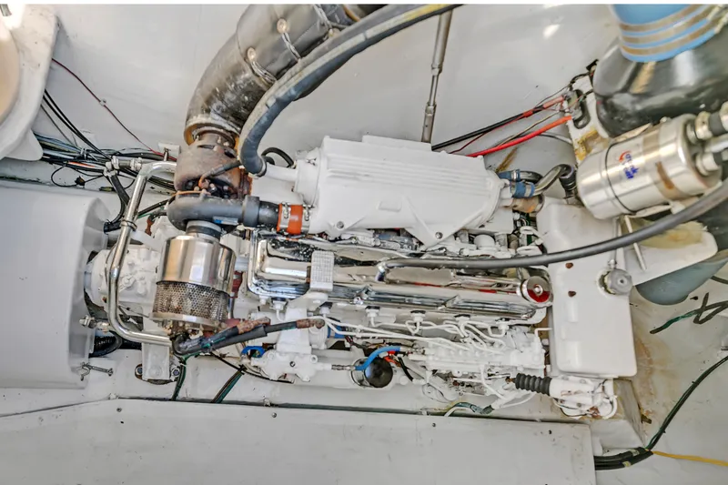 Slide: The Image of Engine compartment of 1988 Kelsall Manannan Custom boat, showcasing detailed mechanical components. - 55