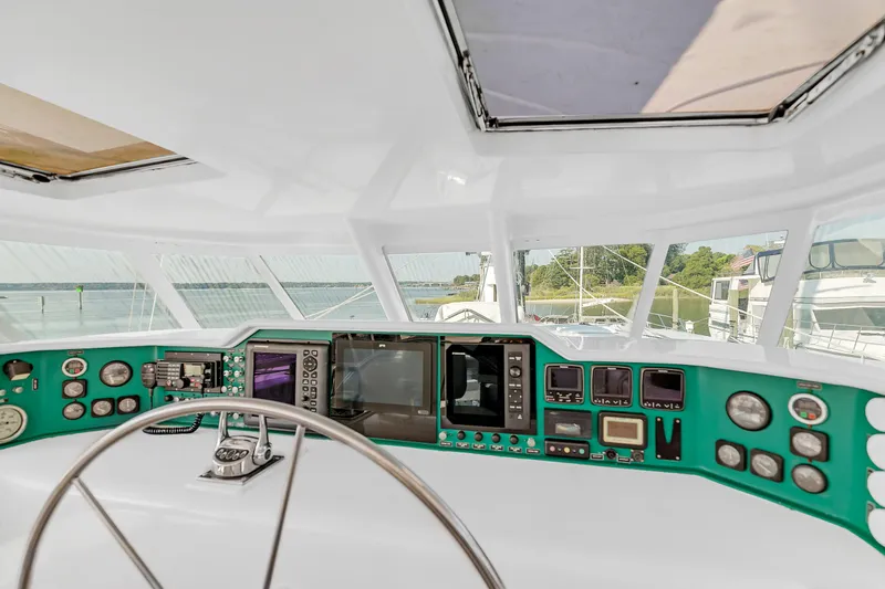 Slide: The Image of Cockpit of 1988 Kelsall Manannan Custom yacht with steering wheel and navigation instruments. - 6