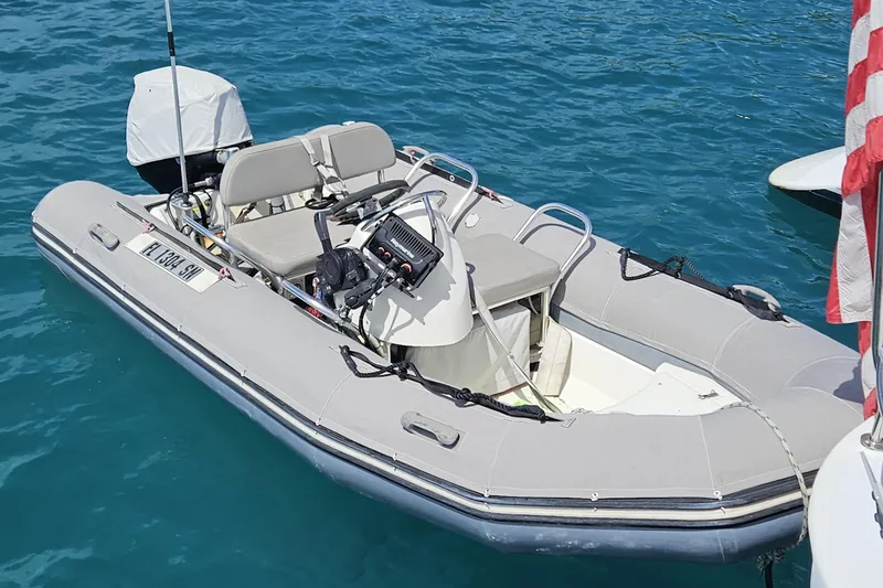 Slide: The Image of Inflatable boat on water, featuring a Kelsall Manannan 78 Custom, 1988 model. - 61