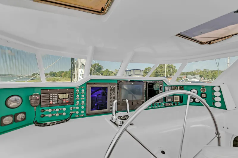Slide: The Image of Cockpit of 1988 Kelsall Manannan Custom yacht with navigation instruments and steering wheel. - 8