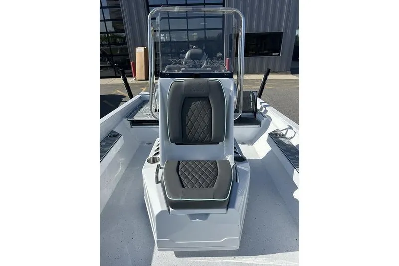 Slide: The Image of 2026 Xpress H22B Bay boat interior with dual seats and console. - 11
