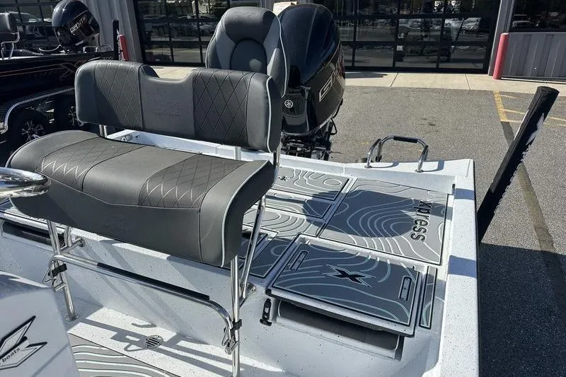Slide: The Image of 2026 Xpress H22B Bay boat interior with seating and deck design. - 6