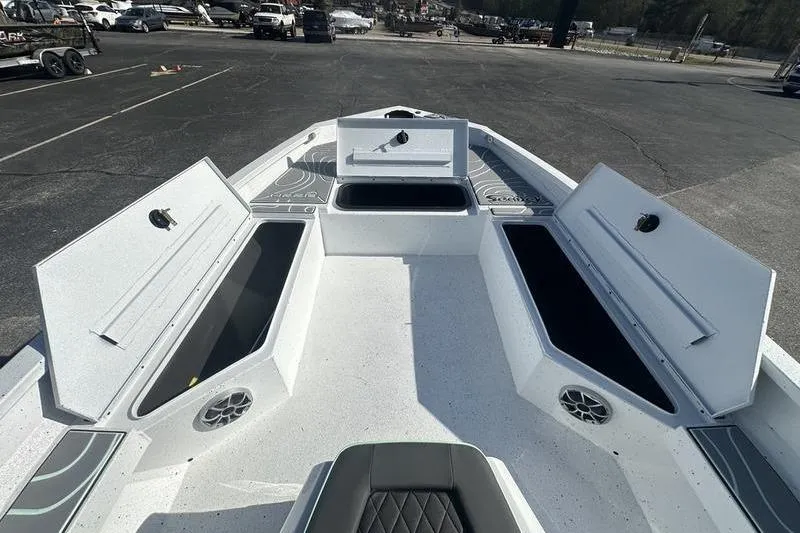 Slide: The Image of 2026 Xpress H22B Bay boat interior with open storage compartments and seating. - 8