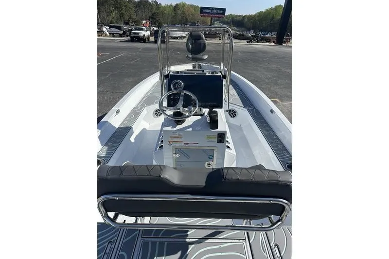 Slide: The Image of 2026 Xpress H22B Bay boat interior with steering console and seating. - 9