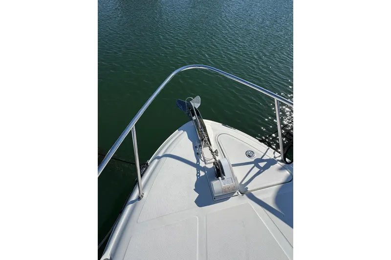 Slide: The Image of Bow of 2005 Sea Ray Sundancer 260 on calm water. - 28