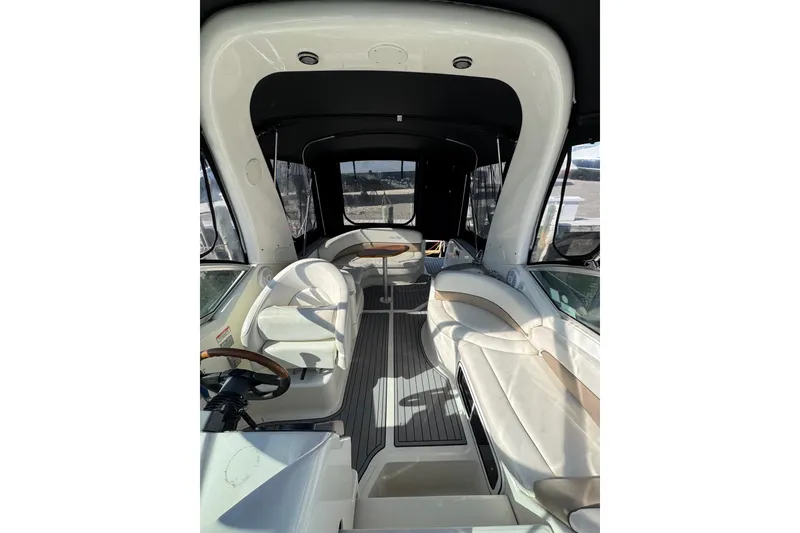 Slide: The Image of Interior view of 2005 Sea Ray Sundancer 260 boat with seating and helm. - 31