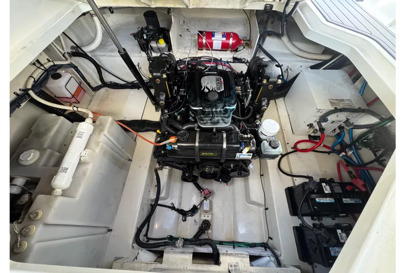 Slide: The Image of Engine compartment of a 2005 Sea Ray Sundancer 260 boat, featuring detailed components. - 33