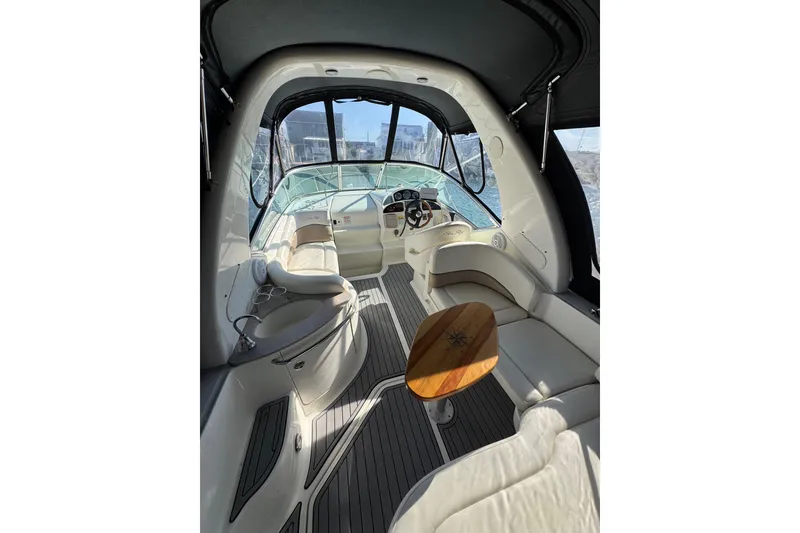 Slide: The Image of Interior of 2005 Sea Ray Sundancer 260 boat with seating and steering wheel. - 7