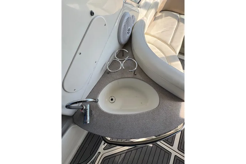 Slide: The Image of 2005 Sea Ray Sundancer 260 interior with sink and seating area. - 8