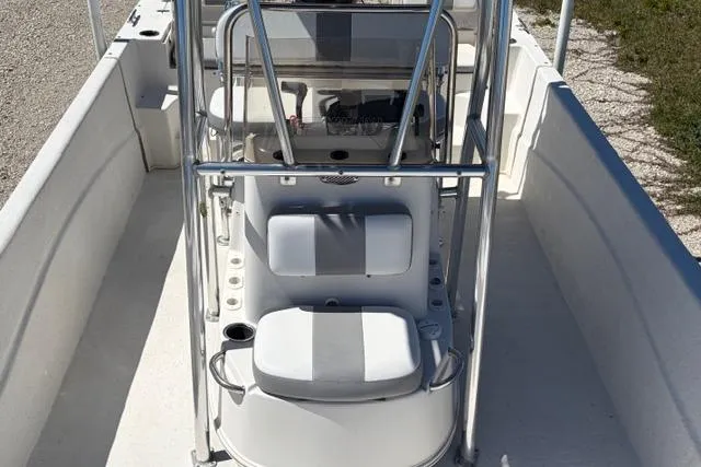 Slide: The Image of 2014 Carolina Skiff 218 DLV boat interior with seating and console. - 12