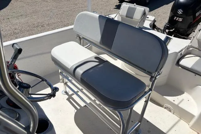 Slide: The Image of 2014 Carolina Skiff 218 DLV boat interior with seating and steering wheel. - 14