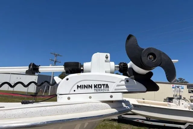 Slide: The Image of Minn Kota Terrova trolling motor on 2014 Carolina Skiff 218 DLV boat, clear sky background. - 3