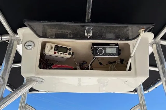 Slide: The Image of 2014 Carolina Skiff 218 DLV boat console with electronic equipment and wiring. - 8