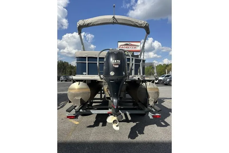 Slide: The Image of 2021 Godfrey Sweetwater 2186 C pontoon boat with outboard motor, parked outdoors. - 5