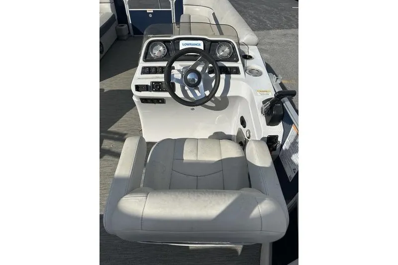 Slide: The Image of 2021 Godfrey Sweetwater 2186 C boat helm with steering wheel and navigation system. - 8