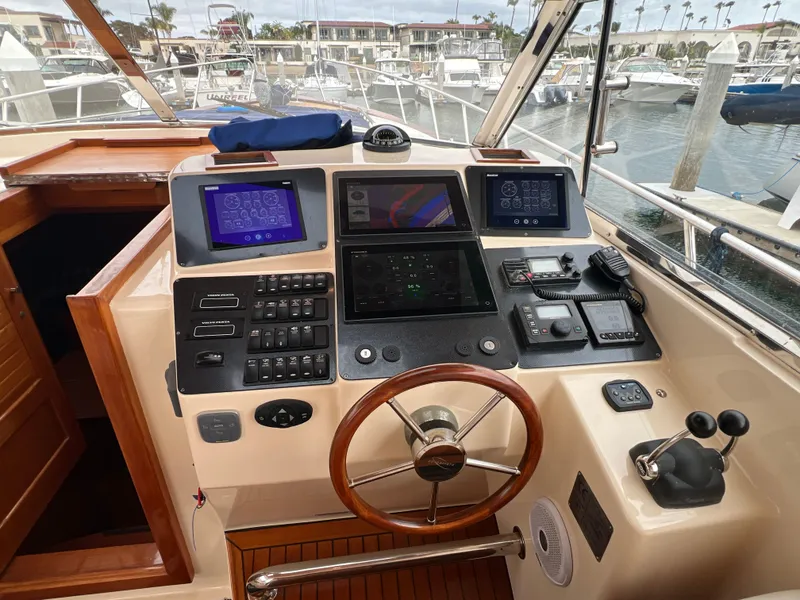 Slide: The Image of Helm of a 2003 Apreamare 40 yacht docked in marina. - 22
