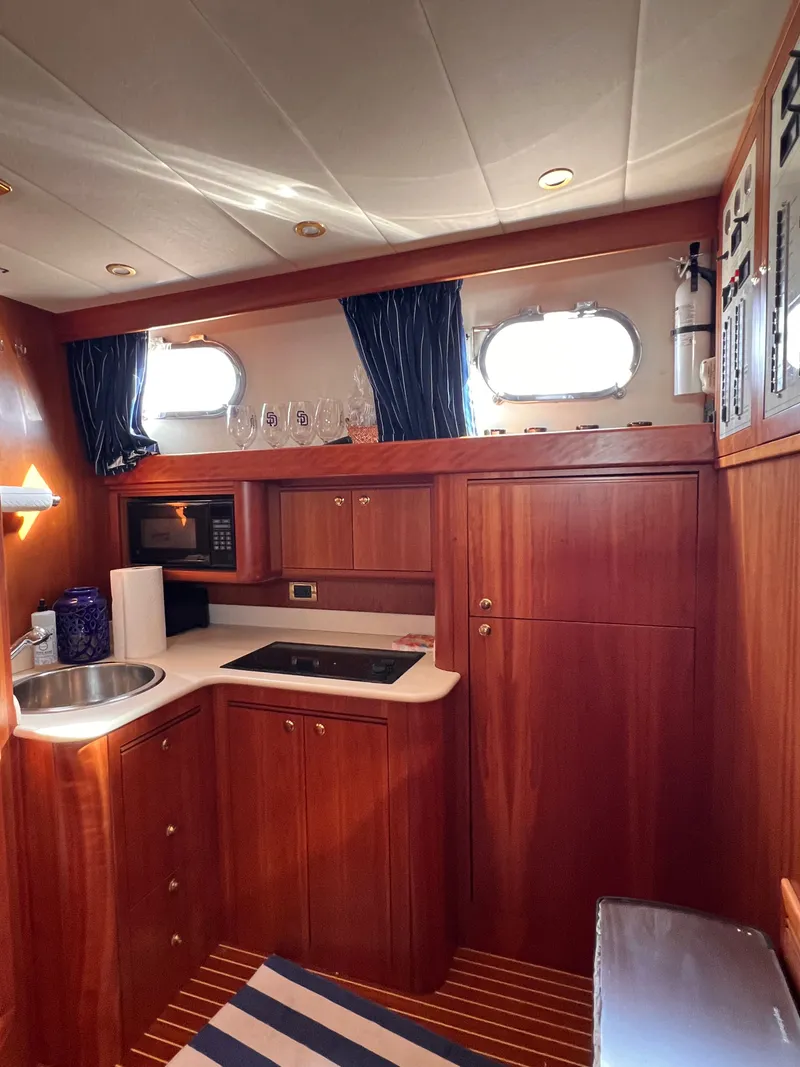 Slide: The Image of Interior of Apreamare 40 yacht, kitchen with wood finish, built in 2003. - 27
