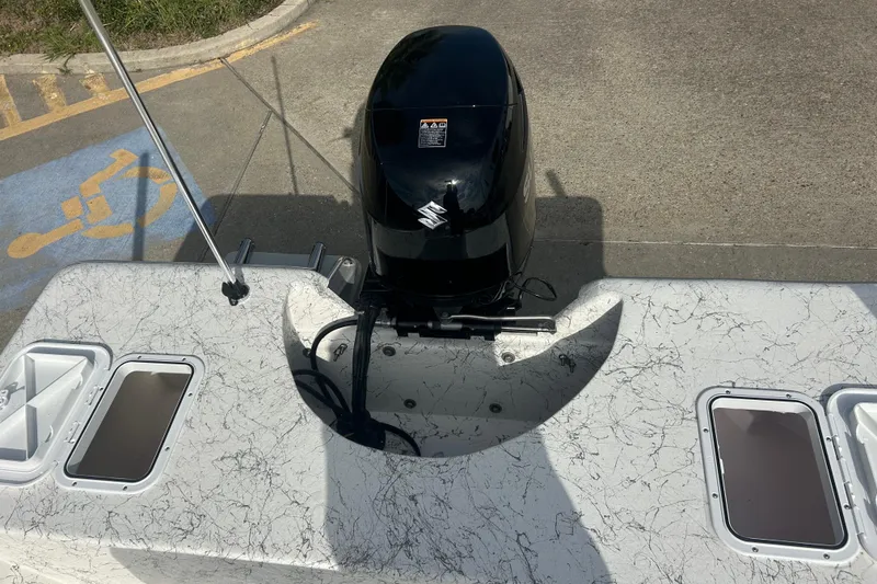 Slide: The Image of 2026 Coastal Skiff 184 boat with Suzuki outboard motor, featuring a marbled deck design. - 19