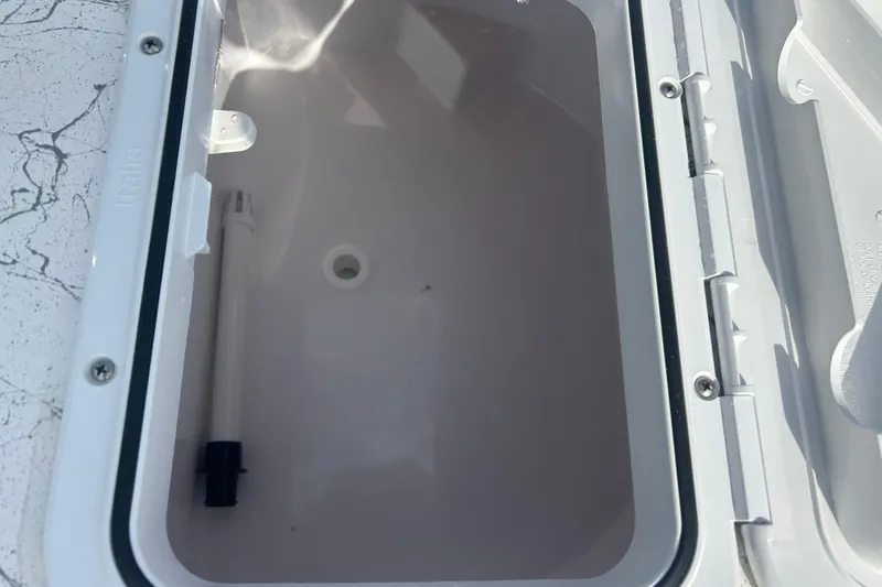 Slide: The Image of Open storage compartment on a 2026 Coastal Skiff 184 boat. - 20