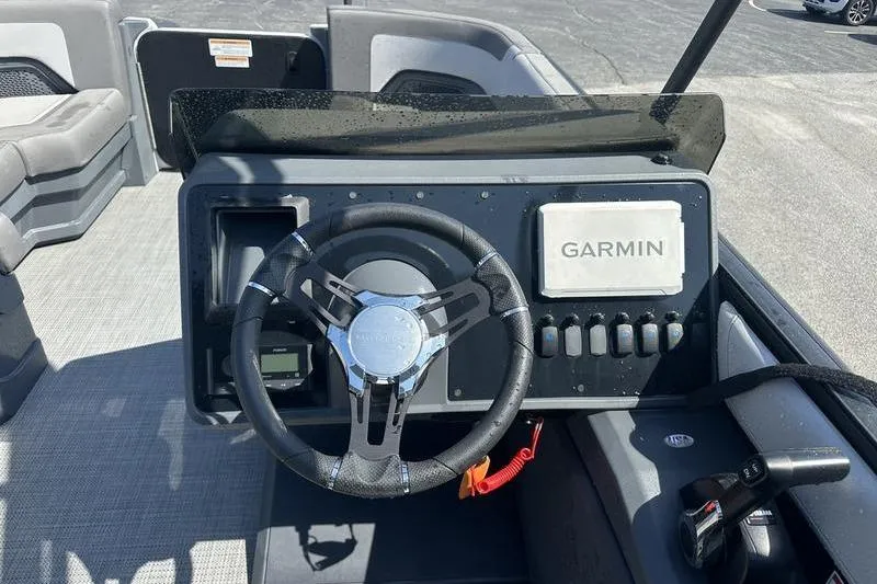 Slide: The Image of 2024 Manitou 24 X-Plode Cruise SHP dashboard with Garmin navigation system. - 6