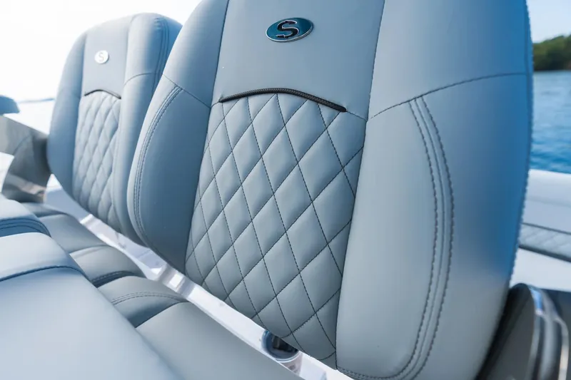 Slide: The Image of Luxurious seating on the 2026 Sportsman Heritage 231 Center Console boat, featuring diamond-stitched upholstery. - 11