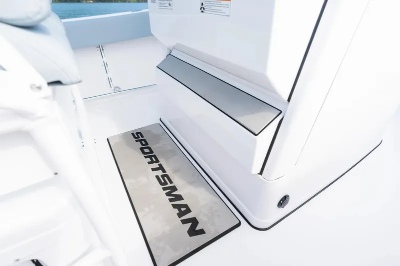 Slide: The Image of 2026 Sportsman Heritage 231 Center Console interior with branded mat and sleek design. - 8