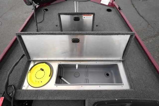 Slide: The Image of 2024 Crestliner 1600 Storm boat interior with storage compartments and livewell. - 10