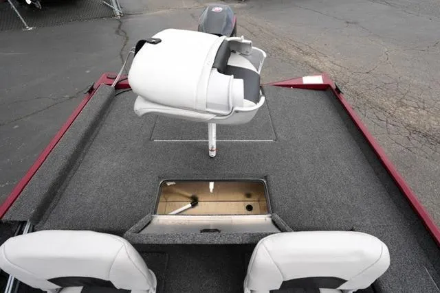 Slide: The Image of 2024 Crestliner 1600 Storm boat interior with seating and storage compartments. - 14