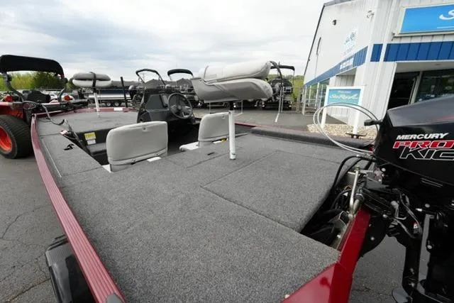 Slide: The Image of 2024 Crestliner 1600 Storm boat with Mercury engine, featuring spacious deck and seating. - 15