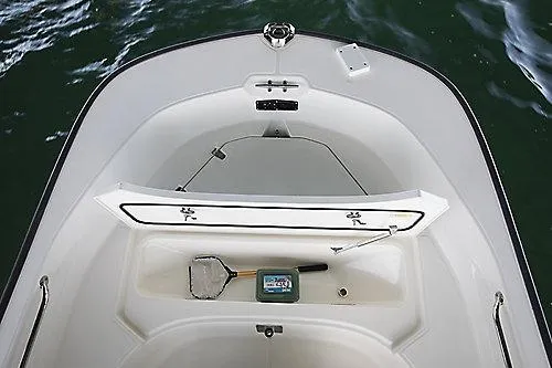 Slide: The Image of 2027 Boston Whaler 170 Montauk boat interior with open storage compartment. - 5