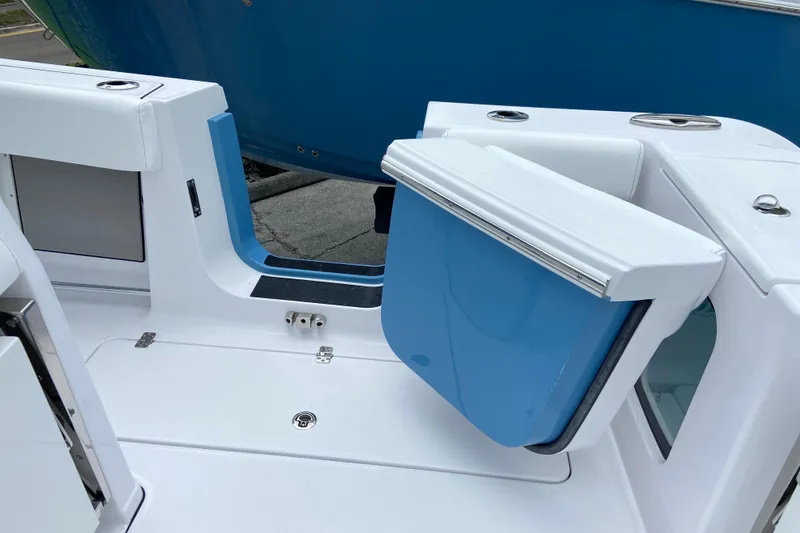 Slide: The Image of 2026 Sportsman Open 302 Center Console boat with open transom door. - 18