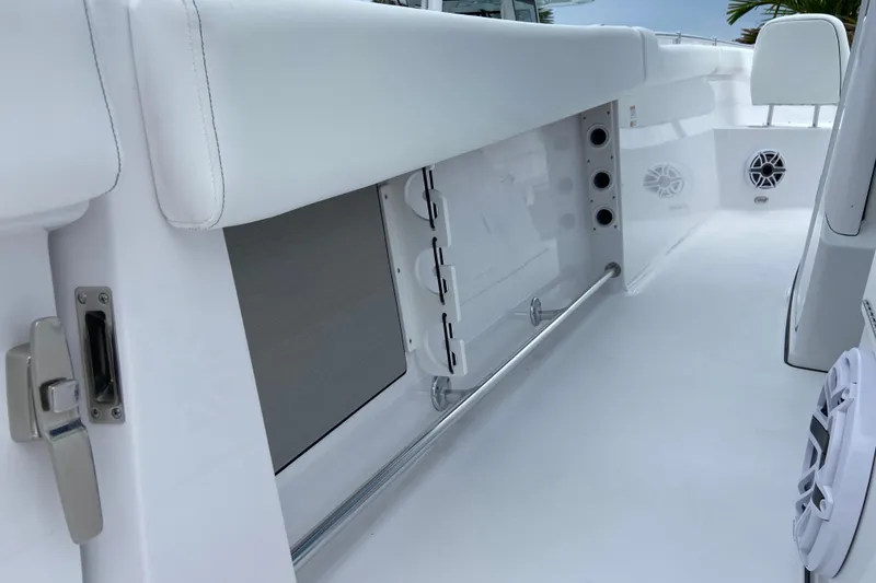 Slide: The Image of 2026 Sportsman Open 302 Center Console interior with sleek white seating and modern fixtures. - 20