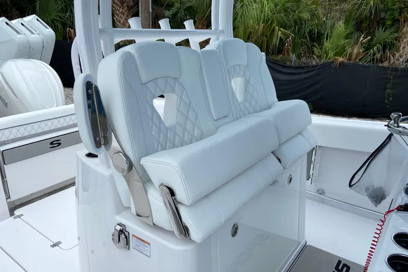 Slide: The Image of 2026 Sportsman Open 302 Center Console boat with luxurious seating and modern design. - 24