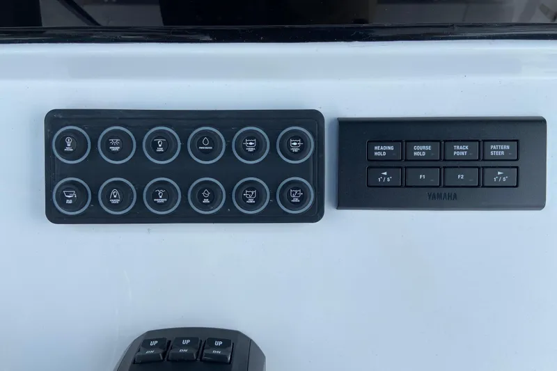 Slide: The Image of Control panel of 2026 Sportsman Open 302 Center Console boat with Yamaha buttons. - 29
