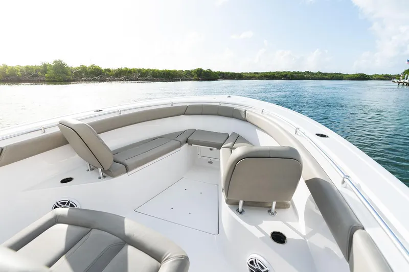 Slide: The Image of Manufacturer Provided Image: 2025 Sportsman Open 302 Center Console boat interior on calm water. - 3