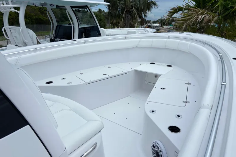 Slide: The Image of 2026 Sportsman Open 302 Center Console boat with spacious seating and storage compartments. - 35