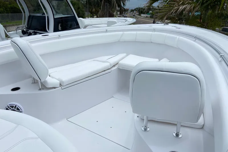 Slide: The Image of 2026 Sportsman Open 302 Center Console boat interior with white seating and sleek design. - 40
