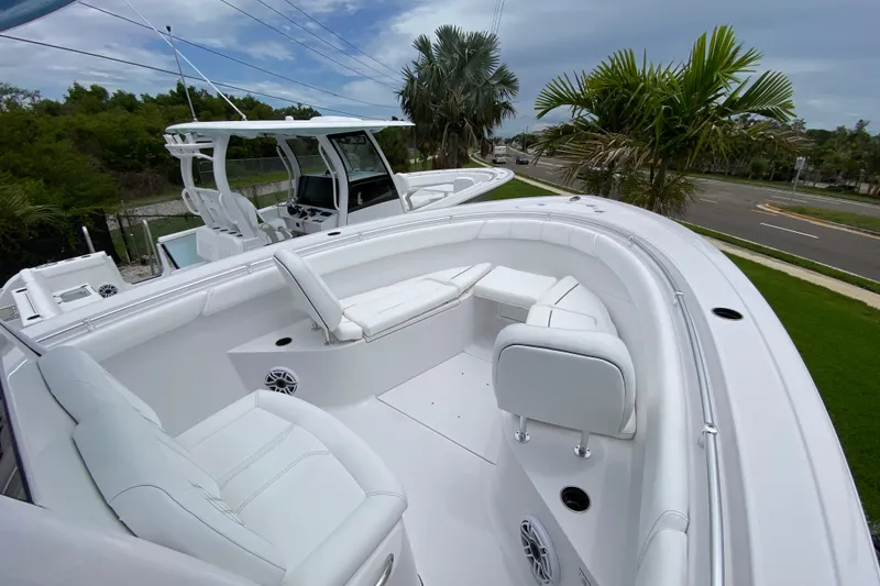 Slide: The Image of 2026 Sportsman Open 302 Center Console boat with sleek white seating and modern design. - 42
