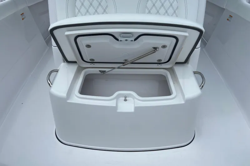 Slide: The Image of Open storage compartment on 2026 Sportsman Open 302 Center Console boat. - 46