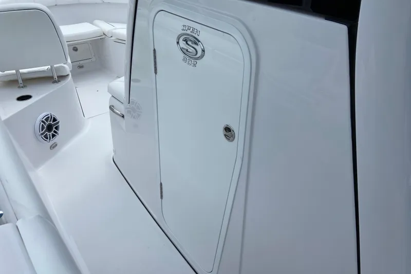 Slide: The Image of 2026 Sportsman Open 302 Center Console interior with seating and speaker detail. - 47