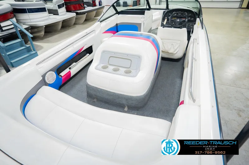 Slide: The Image of Interior of a 1992 MasterCraft ProStar boat with colorful seating and dashboard. - 13
