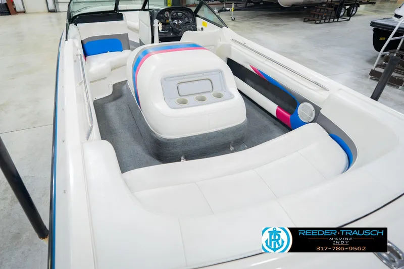 Slide: The Image of Interior of a 1992 MasterCraft ProStar boat with white and blue seating. - 14